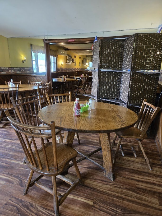 Comfort food setting with relaxed tables.